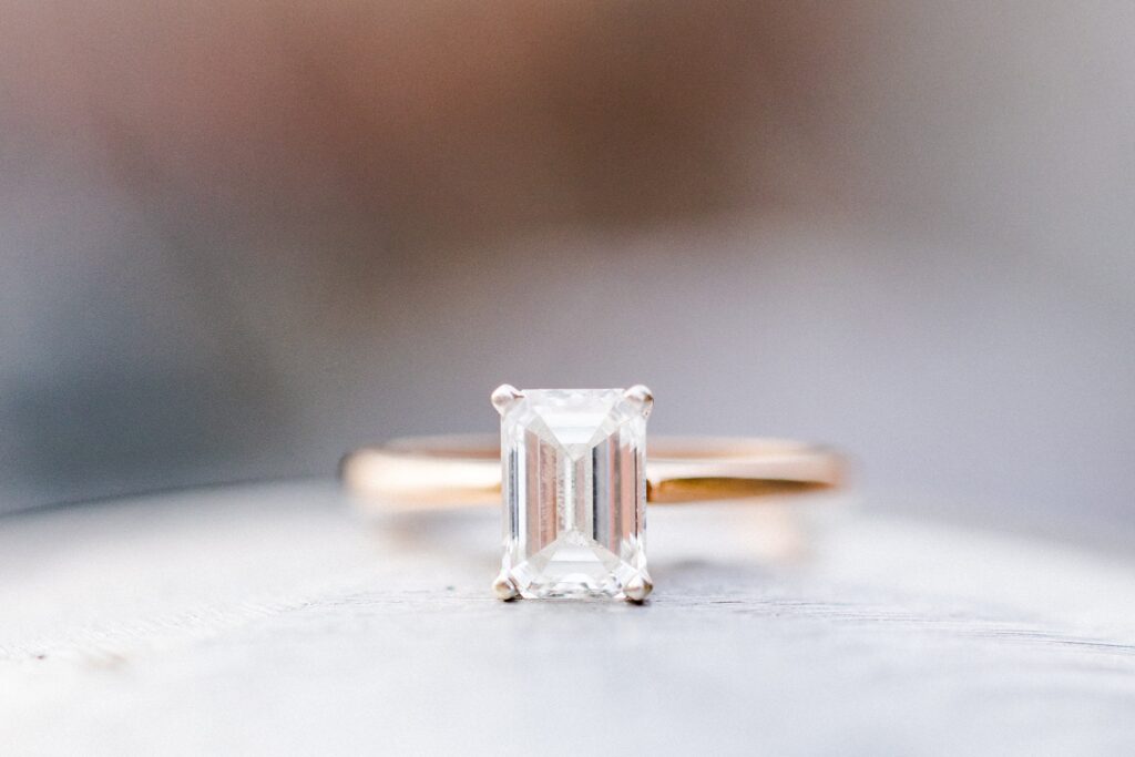 emerald cut engagement ring during a lake front engagement