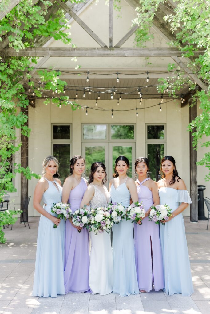bride & her bridesmaids at riverstone in blue and purple dresses