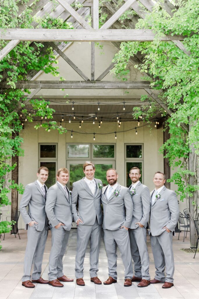 groom and groomsmen in gray tuxes
