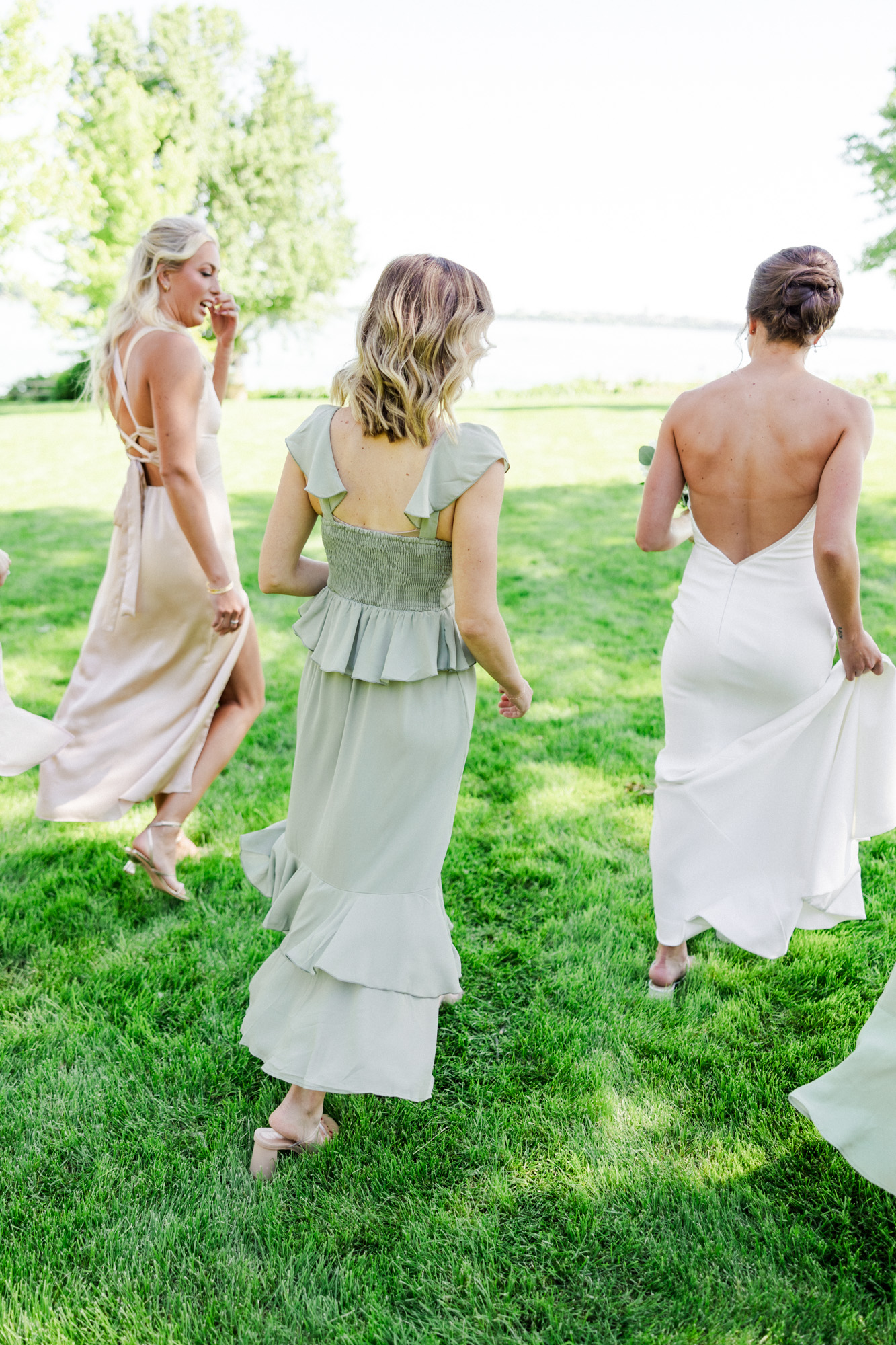 bridesmaids walking towards lake mendota in madison wisconsin