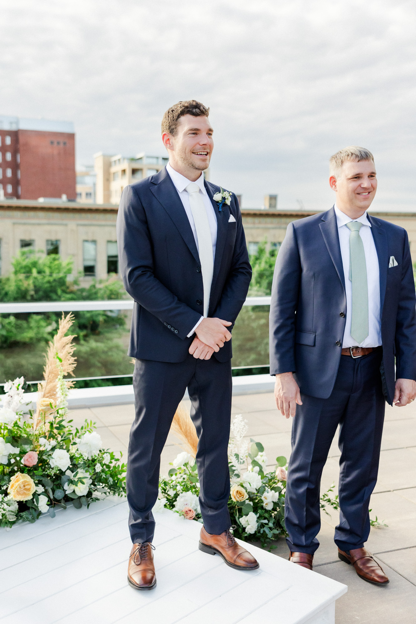 groom waiting for bride during rooftop ceremony celebration