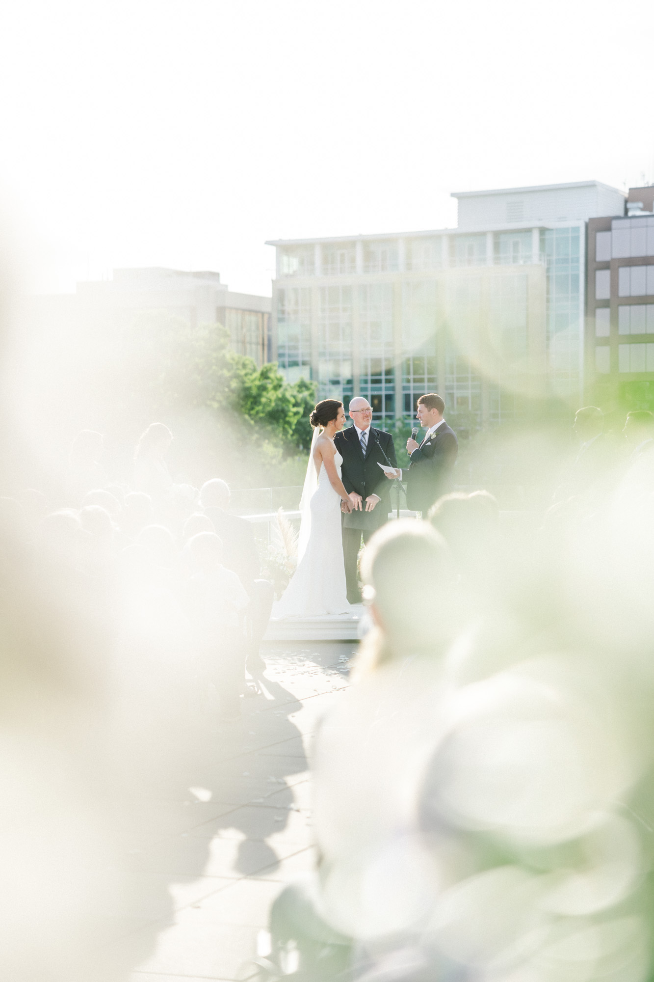 couple sharing vows during their rooftop ceremony