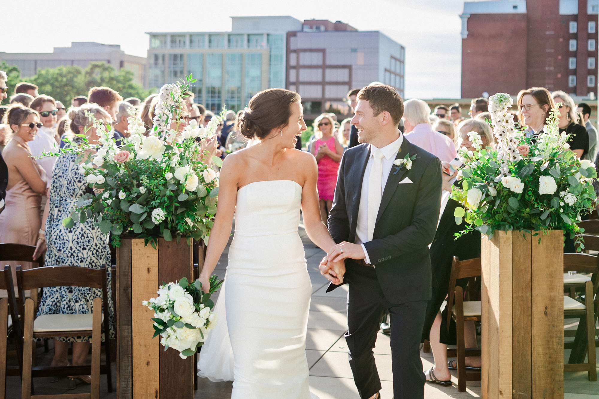  couple laughing during rooftop wedding ceremony