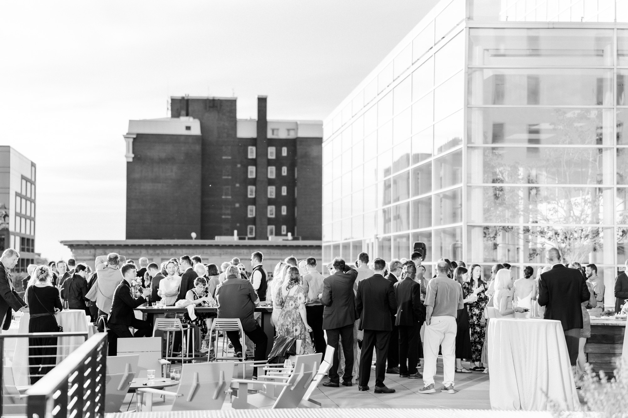 guests enjoying a rooftop welcome party