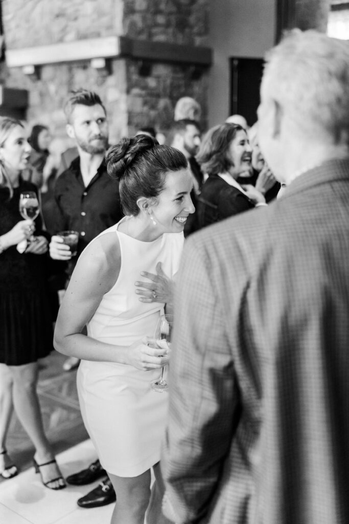 bride laughing during rooftop ceremony